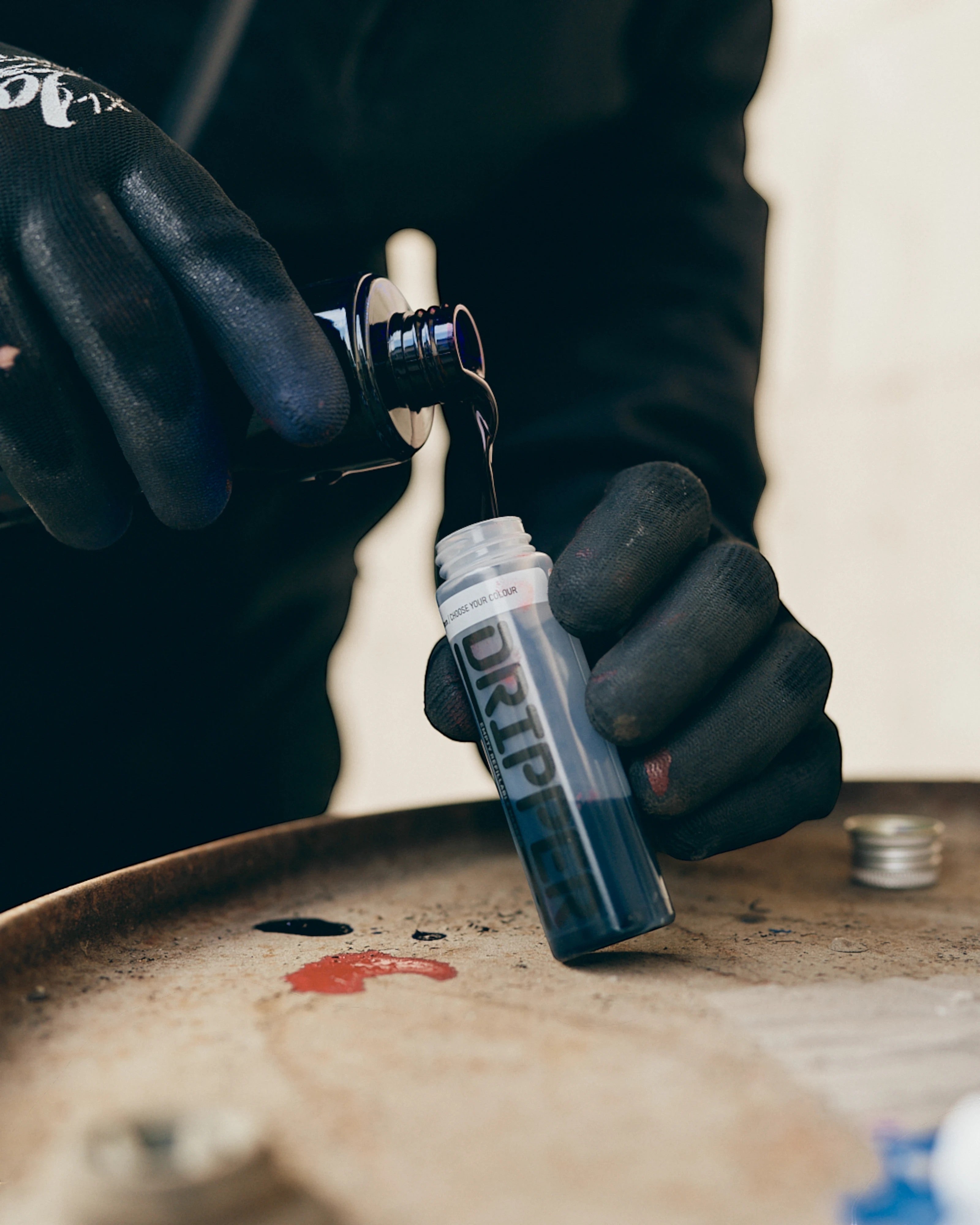 Astrofat Dope Dripper 18mm tagging marker being filled with dark blue ink. Squeezable bottle with 18mm tip.