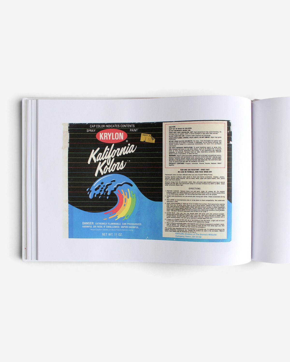 Astrofat Kept Paper Labels art book page featuring a vintage Krylon spray paint label design with rainbow graphic.