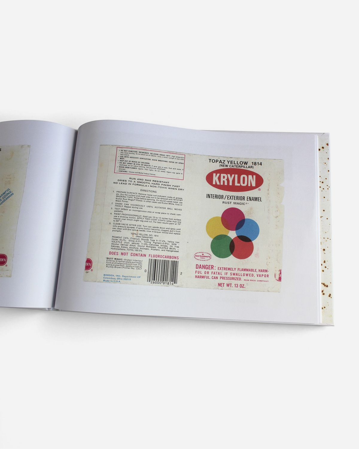 A spread from the Astrofat Kept Paper Labels book featuring a vintage Krylon Topaz Yellow spray paint label design.